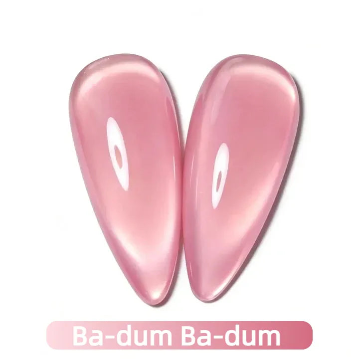 Ba-dum Ba-dum clear and light pink magnetic cat eye gel polish featuring a soft translucent pink tone that creates a delicate 3D nail effect with subtle shimmer and reflective nail design, perfect for natural-looking professional gel manicures with elegant salon-quality shine and multidimensional depth.